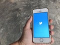 People uses twitter application in iphone SE mobile Royalty Free Stock Photo